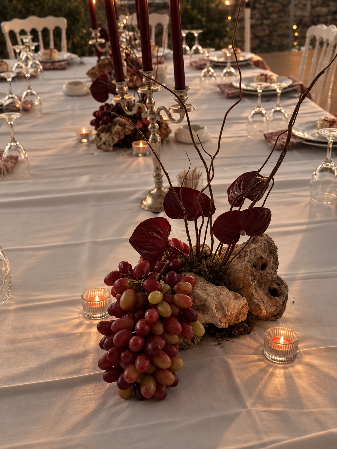 Reception tablescape with candlelight and sculptural florals — Patric and Alexia