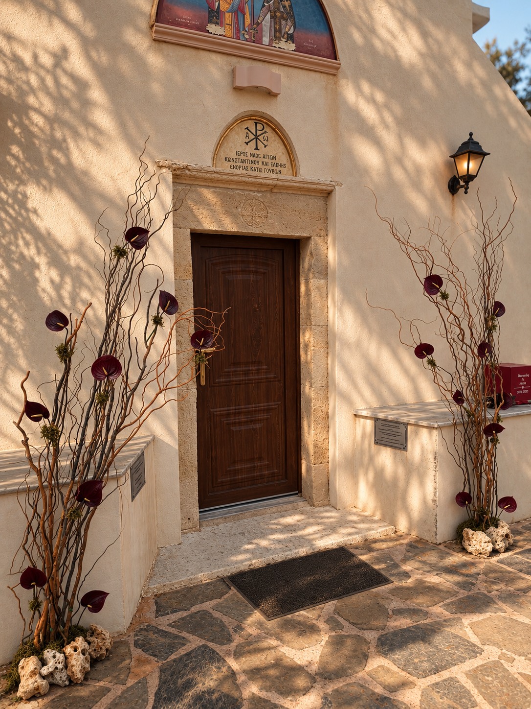 Floral installations framing the chapel entrance — Patric and Alexia